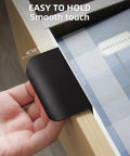 Close-up of black 5 Pack Adhesive Edge Finger Pulls For Cabinets installed on a wooden drawer, featuring no drilling required adhesive design.