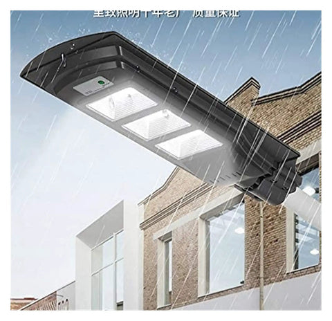 JUDYSSY Courtyard Light Solar Lights Outdoor 350W Outdoor Waterproof Ip67 Floodlight mounted above a building, rains falling.