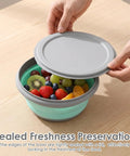 Hands closing lid on collapsible silicone camping bowl set with lids 6 pack food grade dishwasher safe portable lunch bowls