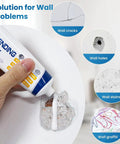 Hand applying spackle from Three Pack Drywall Patch Repair Kit For Holes And Cracks, Spackle Paste Included, Wall Mending Paste For Nail Holes And Dents, Easy Sanding Quick Dry Formula, DIY Home Repair That Lets You Patch Up Walls Like A Pro to a wall hole.