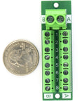 30Amp 48V Terminal Block Distribution Module 2x8 shown with a quarter for size reference.