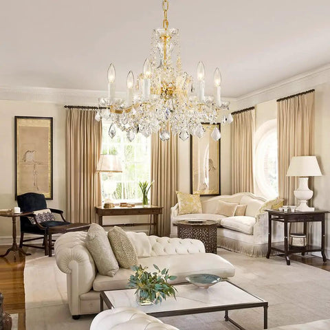 Modern Crystal Chandelier Light Fixture With Six Lights, Raindrop Pendant Crystals in Maria Theresa Brass Finish in living room