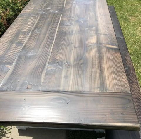 Buckwild Aging Wood Stain Drops Real Barnwood Charm On Any Deck Making Weathering A Hassle Free Experience swirled gray brown wood tabletop