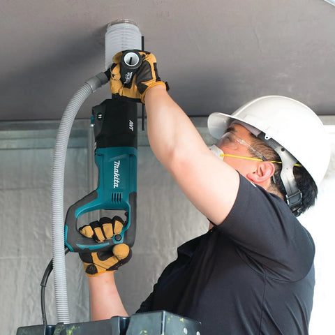 Worker using Beast Mode 8 Amp SDS Plus AVT Rotary Hammer With D Handle 1 Inch Chuck on ceiling for masonry drilling