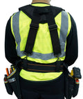 Back view of heavy duty tool belt suspenders with padded straps for all day comfort and back support, worn over a construction vest.