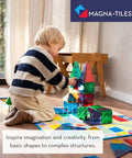 Child playing with Classic 100 Piece Magnetic Construction Set With Translucent Geometric Shapes In Six Colors For Open Ended Building And STEM Fun.