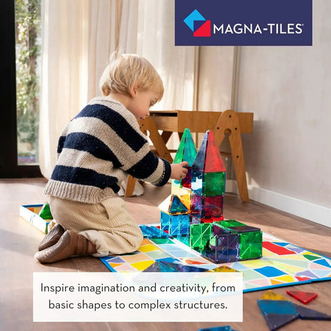 Child playing with Classic 100 Piece Magnetic Construction Set With Translucent Geometric Shapes In Six Colors For Open Ended Building And STEM Fun.