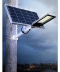 Heavy Duty Solar Security Lights Bringing Knockout Visibility With Smart Motion Sensor LED Flood Lighting And No Sweat Installation For Fences And Porches mounted on pole with solar panel and rain