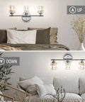 Three Light Crystal Vanity Bathroom Light Fixture, 16 Inch Chrome Over Mirror displayed above beds in cozy rooms with decor.