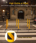 Top Shelf Yellow Steel Bollards 6 Pack 48 Inch Tall 4.5 Inch Diameter heavy duty posts positioned at night for traffic control.