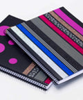 Two spiral notebooks decorated with Fun Dots Washi Tape 6-Roll Set, .59 in x 393 in for journaling and scrapbooking.