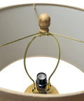 Interior view of Boho Coastal Table Lamp With 23.5 Inch Paper Rope And Wood Base, focusing on the light socket and wood finial.