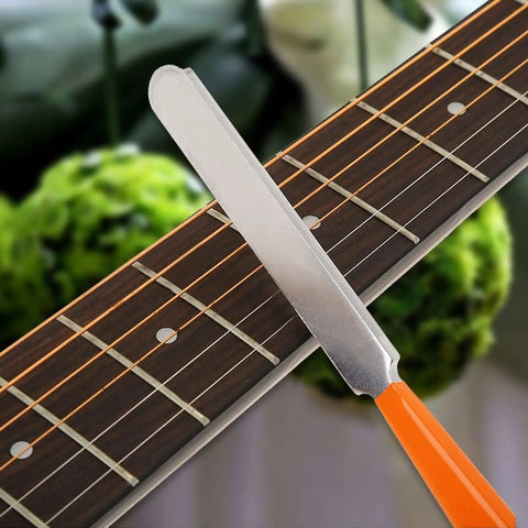 Guitar Luthier Tool Set with fret crowning file on guitar neck for pro grade gear setup on guitar and bass.