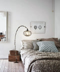 Industrial Pendant Light With Crystal Elements And Plug In Cord, 16.4Ft Hemp Rope Hanging Lamp In Black Cage by bedside in cozy room