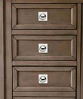 Close-up of heavy duty one and a half inch cabinet knobs with back plate polished nickel finish on wooden drawers.