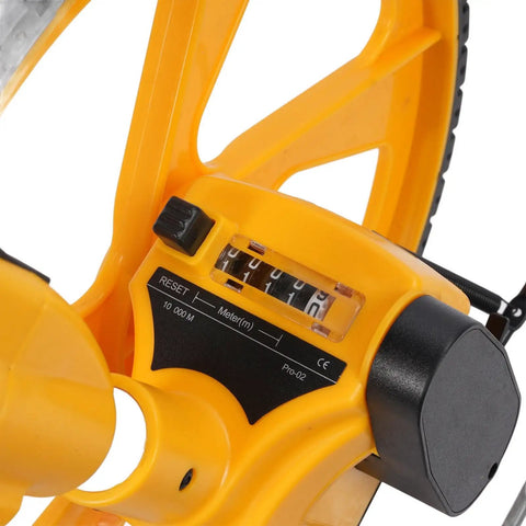 Close-up of the Glomora Measuring Wheel Double Folding Accurate 0-9999.9m showing measurement display and control features.