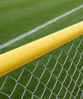 Premium Fence Topper 50 Ft Yellow Chain Link Fence Cover along a field, high viz UV resistant for safety and visibility