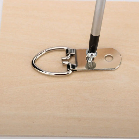 Heavy Duty D Ring Picture Hangers With 400 Screws 200 Pack Double Hole D Hooks For Picture Frames And Mirrors Nickel Plated Iron Built Tough As Nails and Rust Resistant attached to wood.