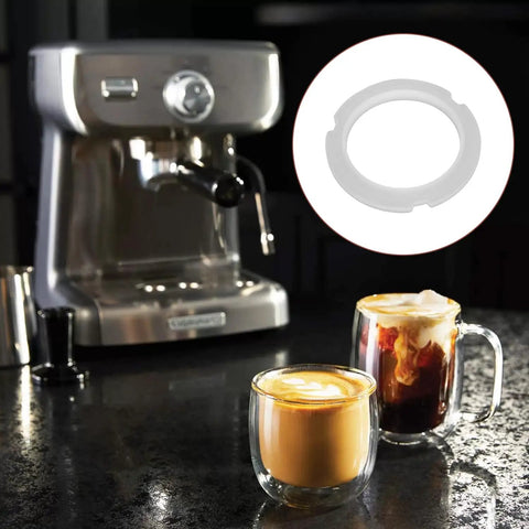 Clear Silicone Sealing Gasket For Coffee Machines 76X57X7MM OE 6V0945246 shown beside an espresso machine
