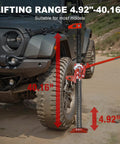 Beefy 48 Inch Ratcheting Off Road Utility Farm Jack, 3 Ton Capacity, lifting SUV tire, red finish, on rugged terrain