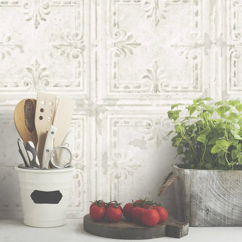 White Tin Tile Metallic Peel And Stick Wallpaper Easy Install DIY Friendly Repositionable And Removable No Mess Accent Wall Decor 20.5 Inch Wide By 16.5 Feet Long Covers About 28.2 Sq Ft displayed behind kitchen items.