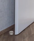 Two Pack Silicone Door Stopper Wedges preventing door slam and finger injuries on wooden floor, home use