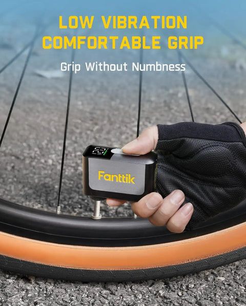 Cyclist using Pocket Size Electric Bike Pump With Gauge 120 PSI Auto Stop for fast road bike inflation, comfortable grip.