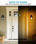 Outdoor Dusk-To-Dawn Wall Light With E26 Base by doorway, half-daylight half-night, showcasing auto on at night feature