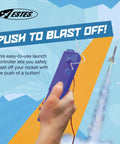 Hand holding 2230 E Launch Controller For Model Rockets And Kits with a rocket blasting off in the background.