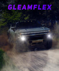 Kickass H11 H8 LED Fog Light Bulbs That Rip Through Fog And Blast 12000 Lumens Of Clean 6000K Cool White Illumination With Turbo Cooling And IP68 Waterproof Rating For Cars SUVs And Powersports Rides Pack Of Two in front of a powerful off-road vehicle.