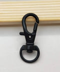 Chill Out With This Badass 150 Piece Black Swivel Snap Hook And Key Chain Kit showing a black lobster clasp hardware piece.