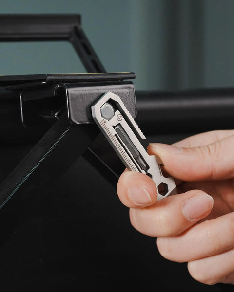 Person using KR03 EDC Pry Bar Multitool With Flathead And Phillips Driver, Bottle Opener, Three Hex Wrenches, Built In Metric And Imperial Ruler