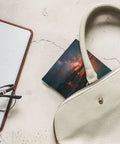 Compact PU Leather Coin Purse And No Zipper Makeup Bag With One Hand Open Shrapnel Hardware on a table with accessories.
