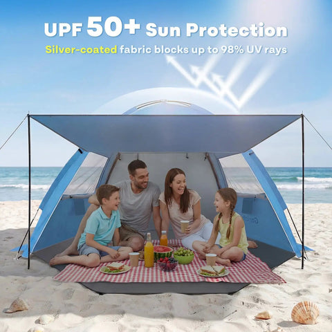 Family enjoying a picnic under a Beach Tent Sun Shelter With Canopy That Pops Up In Minutes, UPF 50 UV protection, on the beach.
