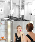 Luxurious bathroom and vanity with lighting, showing mirrors, dark stone countertops, and elegant decor.