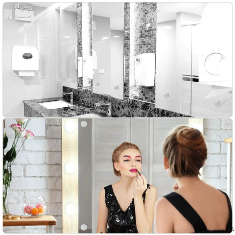Luxurious bathroom and vanity with lighting, showing mirrors, dark stone countertops, and elegant decor.