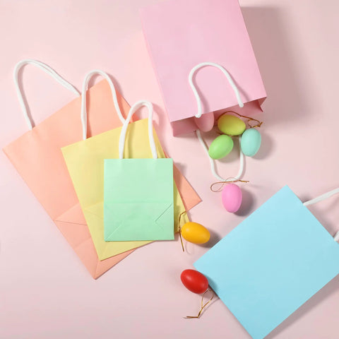 Pastel Gift Bags With Handles, 8 Pack, Assorted Sizes, Durable Eco Friendly Paper Bags for gifts on pink background
