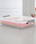Four Pack Clear Plastic Storage Bins With Write On Latching Lids Modular Stackable Organizer Boxes For Closet Bedroom Garage Office. Transparent box with colorful paper sheets.