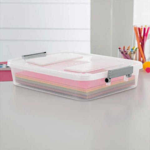 Four Pack Clear Plastic Storage Bins With Write On Latching Lids Modular Stackable Organizer Boxes For Closet Bedroom Garage Office. Transparent box with colorful paper sheets.