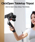 Person holding One-Click Opening Vlogging Tripod With Quick-Release System and camera, showing handheld use