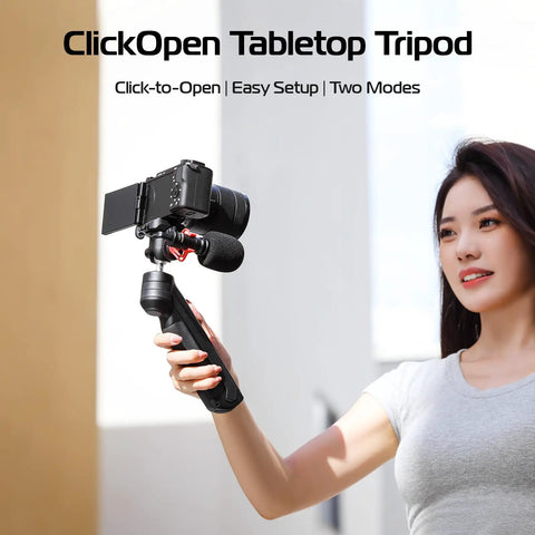 Person holding One-Click Opening Vlogging Tripod With Quick-Release System and camera, showing handheld use