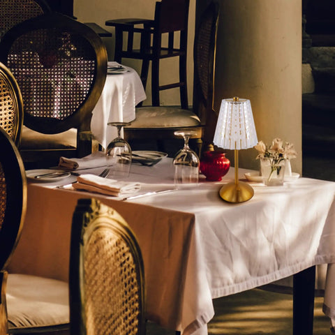 Cordless Table Lamp With Rechargeable Battery in a restaurant setting, featuring LED touch lamp with crystal gold metal design.