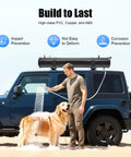 Man using the Self Pressurized Portable Car Shower System For Outdoor Rinse Camping Beach And Surf Trips Hiking And Fishing Off Road SUV And RV Ready 7.93 Gallon Water Capacity For Quick Cleanups to wash his dog by a blue SUV.