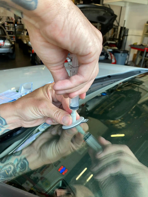 Bullseye Windshield Repair Kit With 0.025 Oz Syringe for Quick, No Mixing One-Component Fix on laminated auto glass demonstration