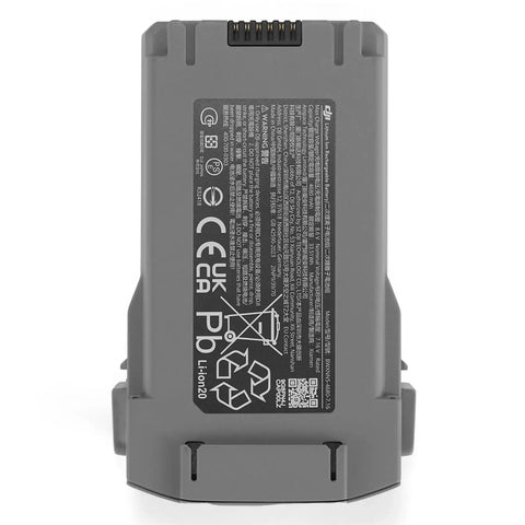 Close-up of Intelligent Flight Battery Plus for Mini 5 Pro, grey color, vertical design with labels. Delivers up to 52 minutes of flight time.