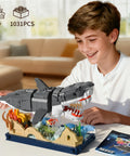 Boy assembling Beefy Mechanical Shark Build Kit With 1031 Pieces For Adults And Teens, featuring movable gear system and display stand.