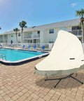 Outdoor 73 Inch Patio Hanging Chaise Lounge And Stand Cover installed, poolside setting, 600D heavy-duty, waterproof, UV-resistant.