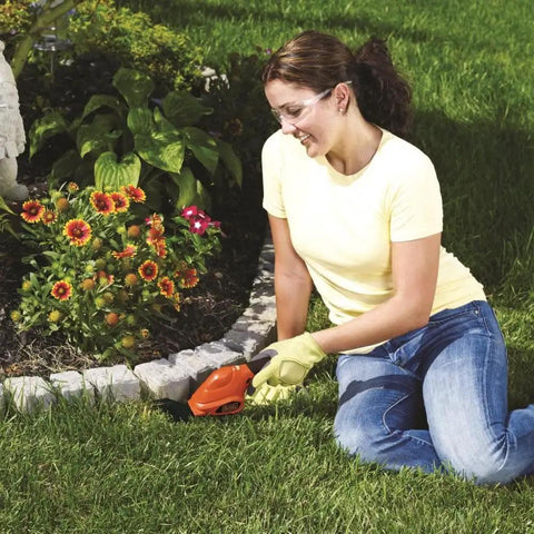 Woman using Cordless Shrub Trimmer And Grass Shear Combo, Lightweight Three Point Six Volt Lithium Battery for lawn edging
