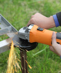 Person using Powerful 6 Amp Angle Grinder Kit 4-1/2 Inch 11,000 RPM Metal Cutter with Quick Change Guard for rust removal on metal