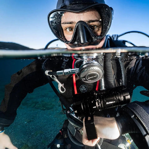 Scuba diver using Beast-Mode 15000 Lumen Scuba Dive Light With Type-C Rechargeable, Six XHP50 LEDs and IPX8 Waterproof in water.